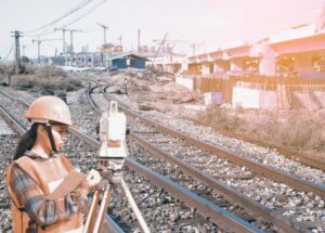 engineering-female-survey-engineer-railway-tracks