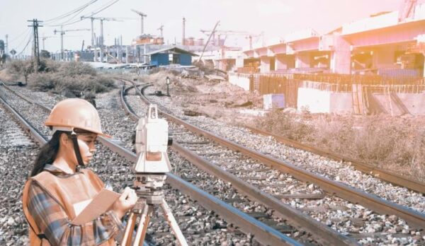 engineering-female-survey-engineer-railway-tracks